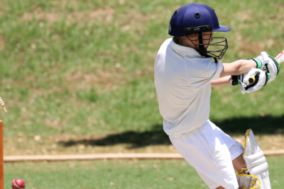 A cricket ball spinning in the air